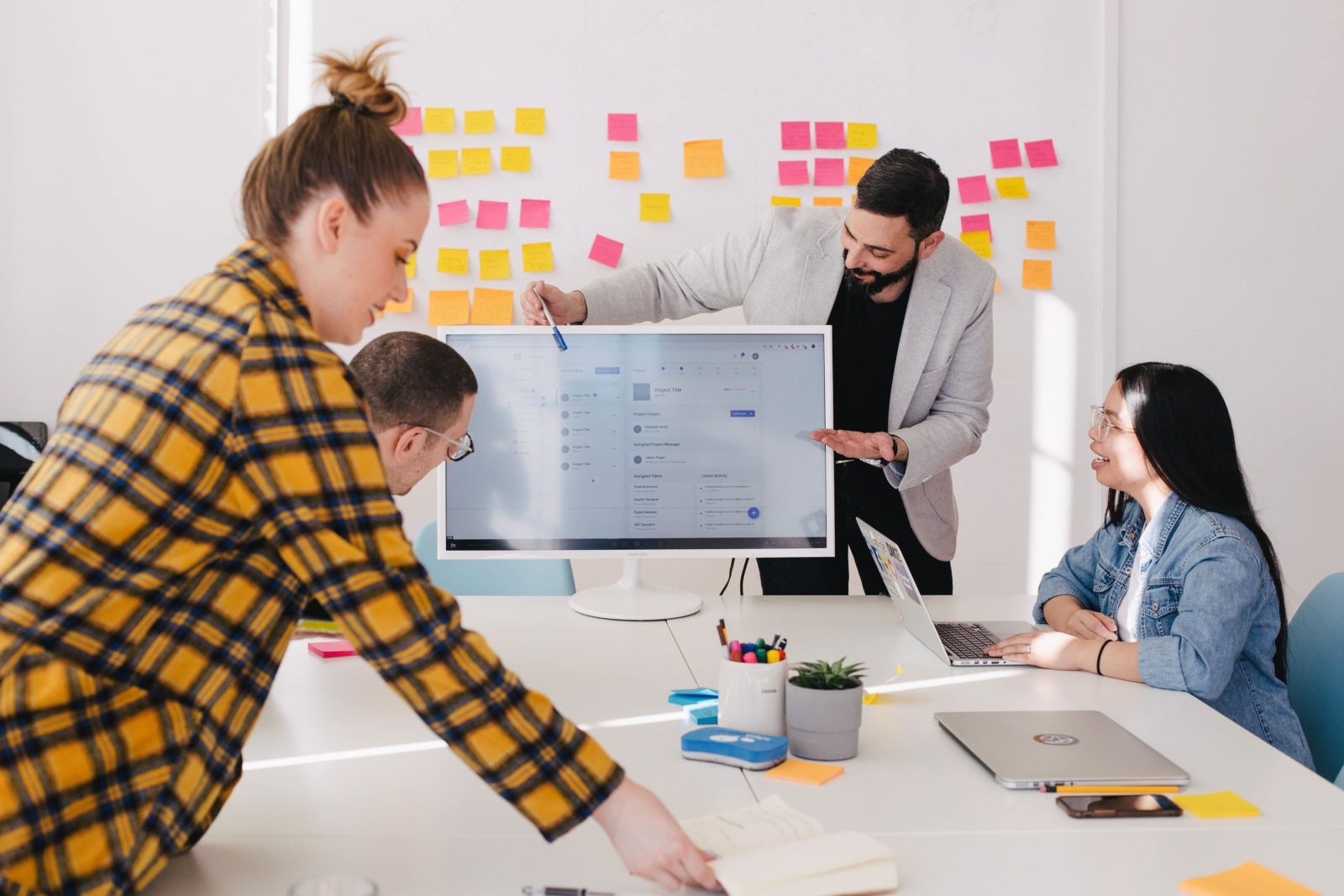 Employees show how the company works to a new one